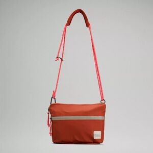 New Lululemon Patch Logo Crossbody Bag 2.5L Orange Black NWT Brand New with Tags